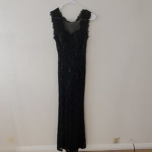 Selling a long, fitted black dress